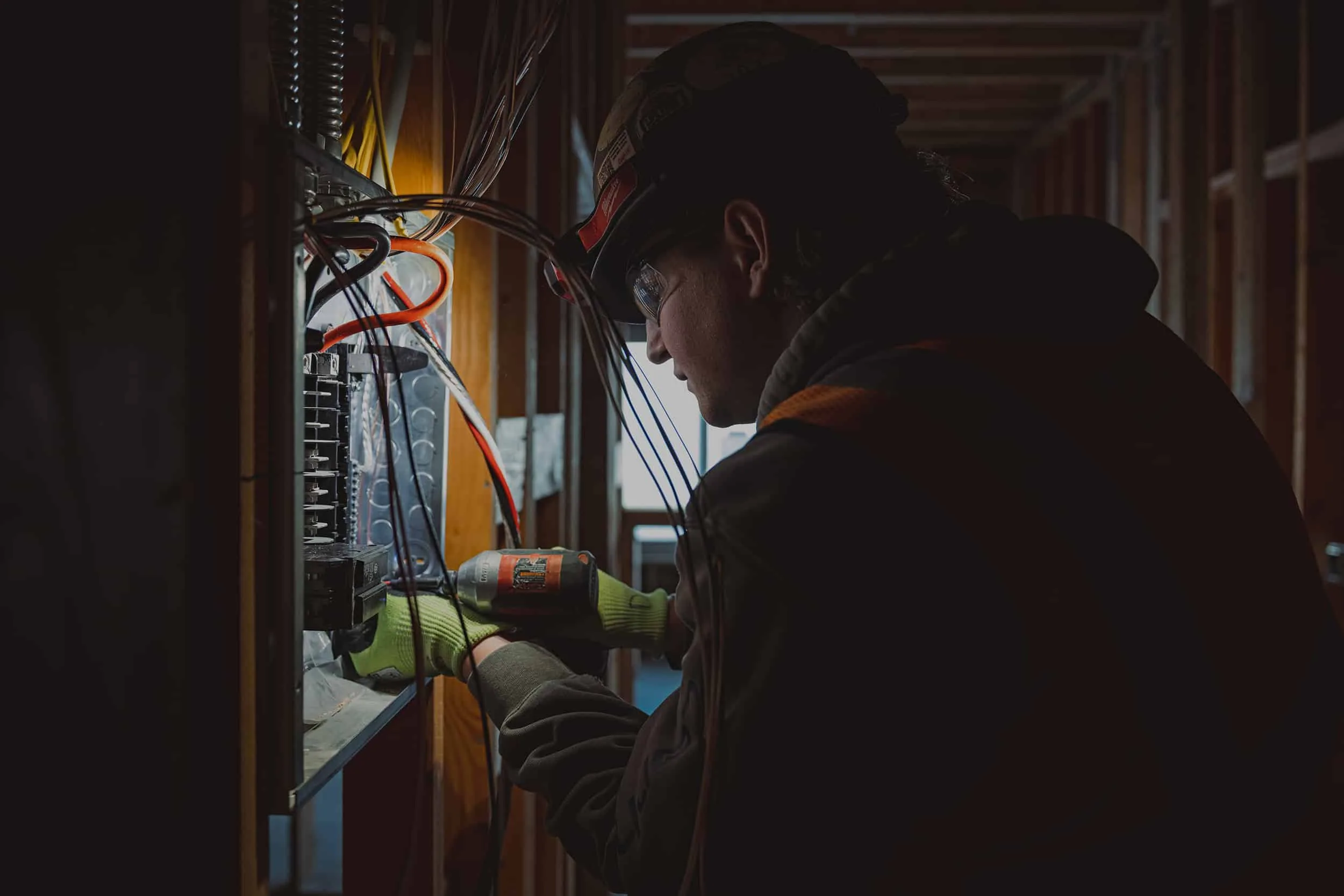 Commercial electrician working on an electrical panel in Oakville